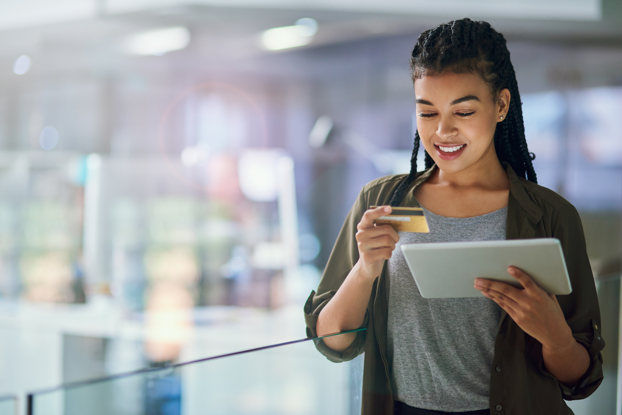 woman making a credit card purchase on a tablet