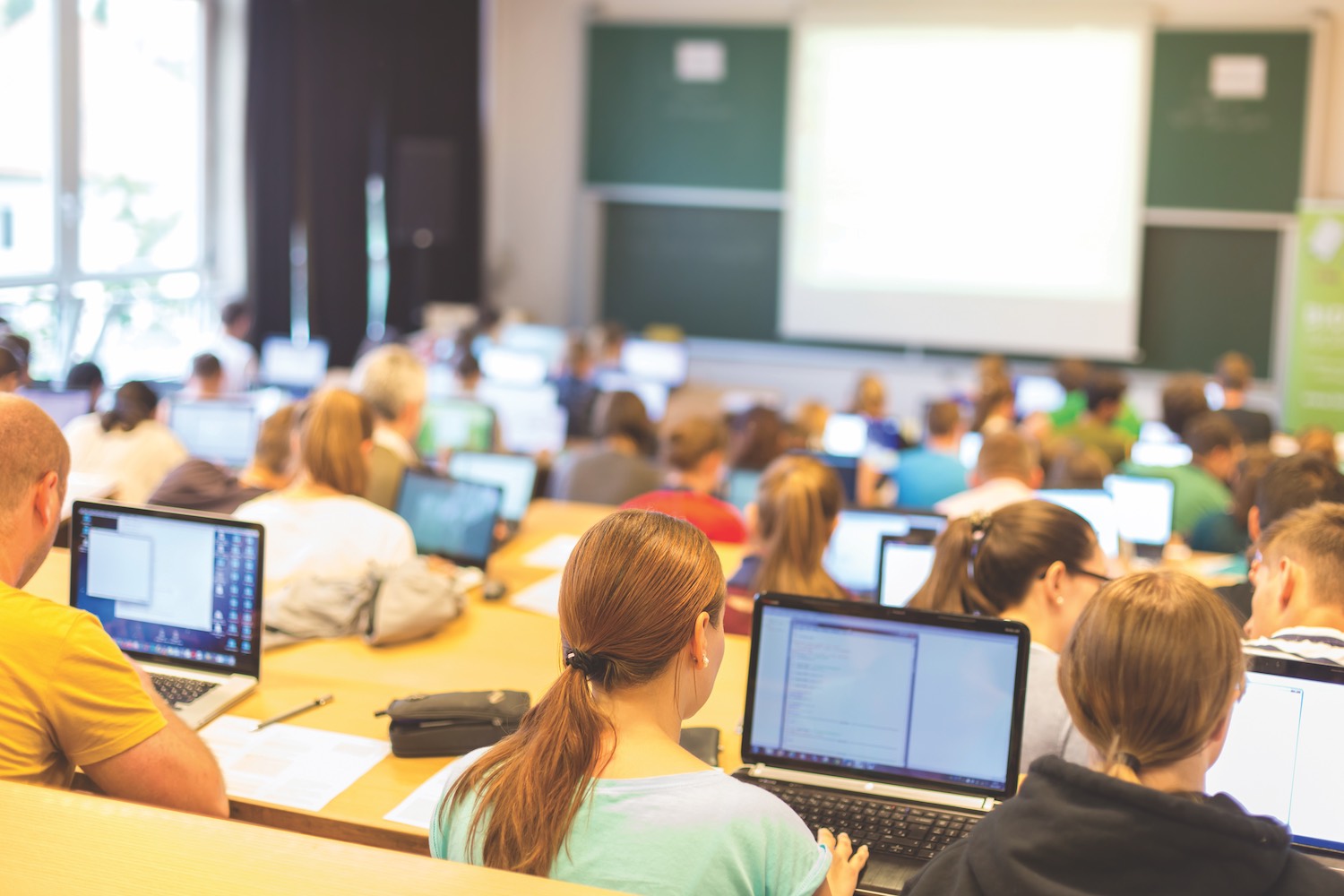 Lecture hall filled with students on laptops