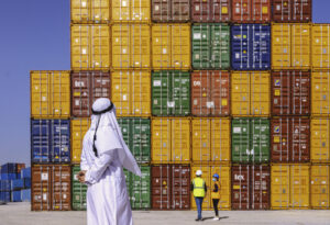 Arab Businessman checking and standing outside on a large commercial dock