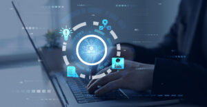 Engineer using laptop for optimization software